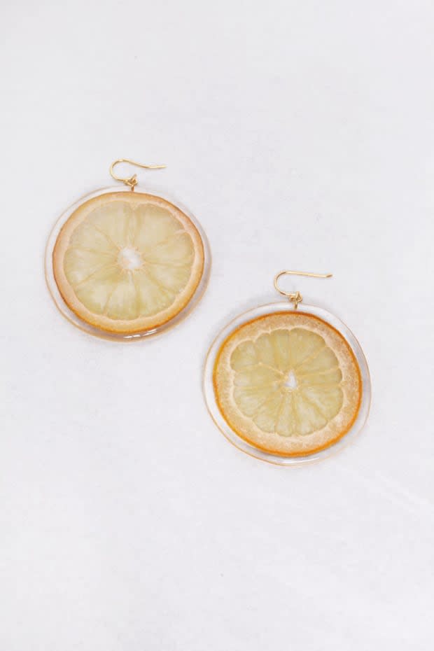 <p>Dauphinette Slice Earrings, $96, <a href="https://www.garmentory.com/sale/dauphinette/earrings-drop/1183113-dauphinette-orange-slice-earrings?gclid=Cj0KCQjwyN-DBhCDARIsAFOELTk2EVkmyWJcFCzx3zQqny03E30dSr26lzXplcXur0BNmIrG3VJ_sysaAvWhEALw_wcB" rel="nofollow noopener" target="_blank" data-ylk="slk:available here;elm:context_link;itc:0;sec:content-canvas" class="link ">available here</a>. </p>