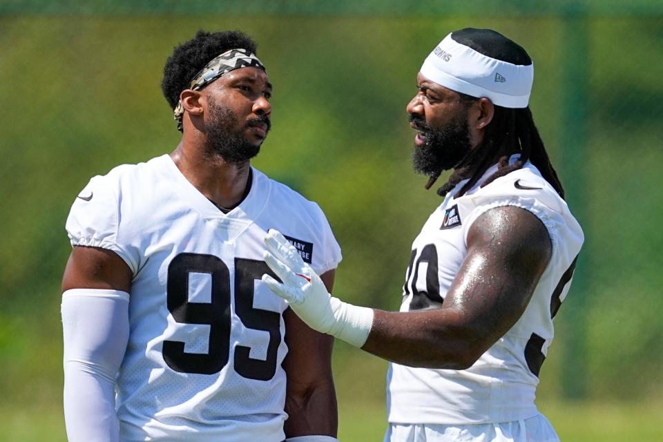 Browns defensive ends Za'Darius Smith, right, and Myles Garrett talk Monday, July 24, 2023, in White Sulphur Springs, W.Va.