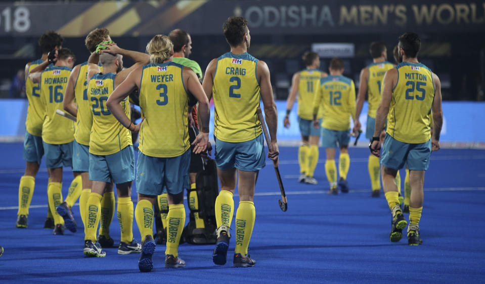 Australian players react as they leave the field after their loss against Netherlands in the Men's Hockey World Cup semifinal match at Kalinga Stadium in Bhubaneswar, India, Saturday, Dec. 15, 2018. (AP Photo/Aijaz Rahi)