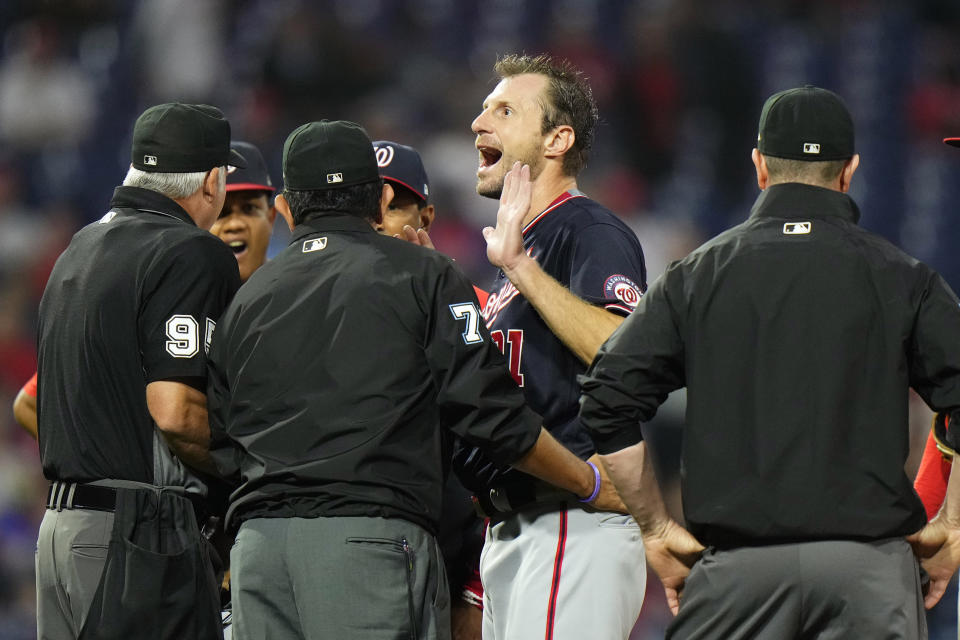 Washington Nationals pitcher Max Scherzer reacts as he talks with umpires during a foreign substances check in the middle of the fourth inning of a baseball game against the Philadelphia Phillies, Tuesday, June 22, 2021, in Philadelphia. (AP Photo/Matt Slocum)