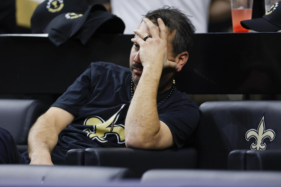 A New Orleans Saints fan watches play against the Dallas Cowboys during the second half of an NFL football game, Thursday, Dec. 2, 2021, in New Orleans. (AP Photo/Brett Duke)