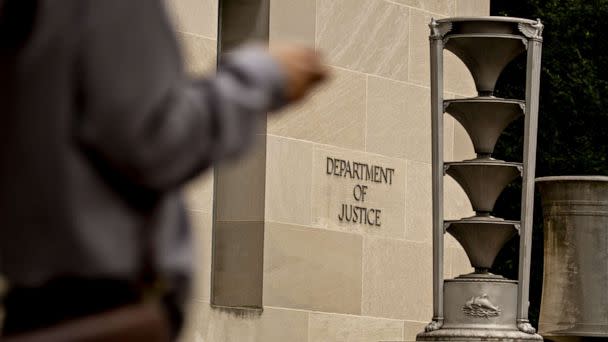 PHOTO: A pedestrian walks past the Department of Justice (DOJ) headquarters in Washington, D.C., Aug. 15, 2019. (Andrew Harrer/ via Getty Images, FILE)