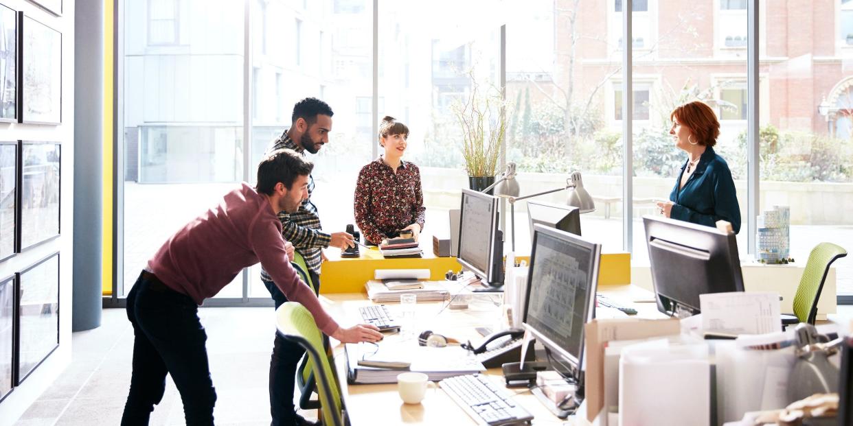 coworkers collaborating in office space