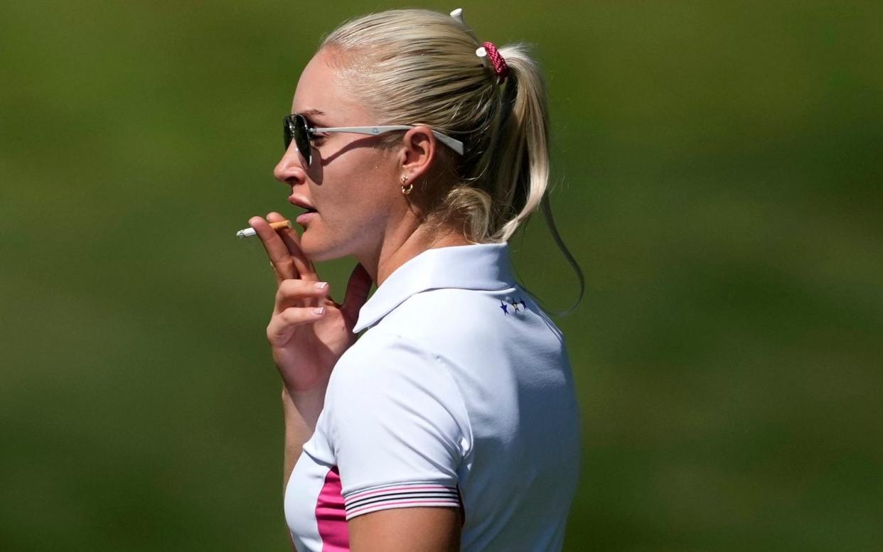 Charley Hull smokes on the 17th fairway during a practice round prior to the Solheim Cup