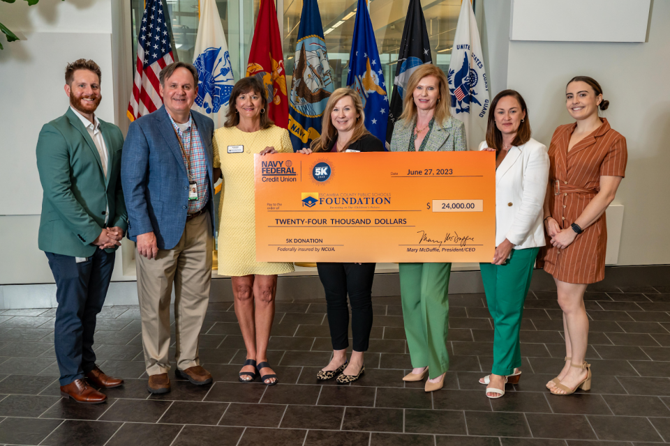 Navy Federal Credit Union recently donated proceeds from the 13th annual Navy Federal Credit Union 5K to the Escambia County Public Schools Foundation.