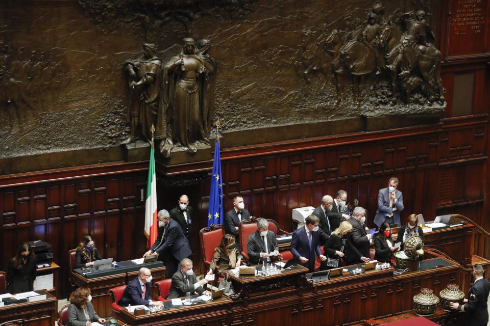 President of the lower Chamber, Roberto Fico, center, counts the votes at the end of a voting session in the Italian parliament, in Rome, Monday, Jan. 24, 2022. The first round of voting for Italy's next president opens Monday without a clear slate of candidates. Political parties held internal meetings over the weekend, but were keeping the names of possible candidates close to their vests. (Yara Nardi, Pool photo via AP)