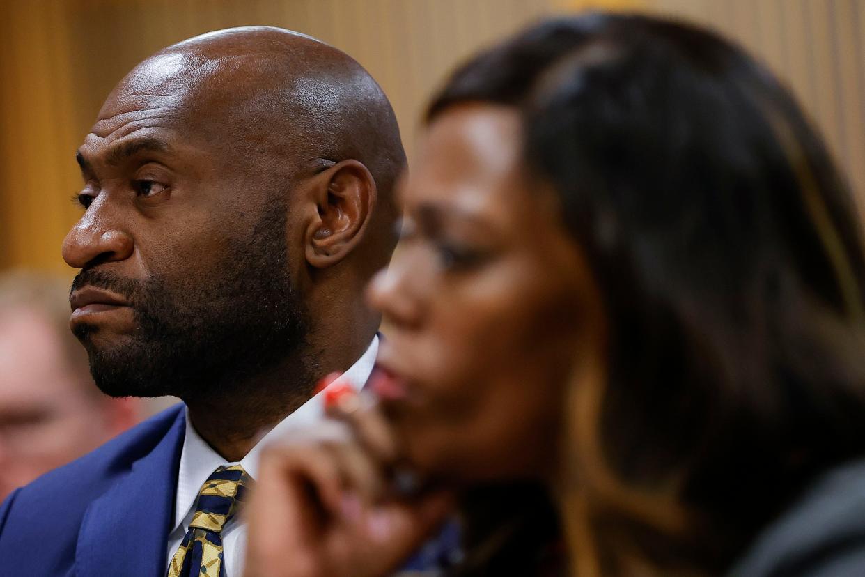 Special Prosecutor Nathan Wade, left, looks on during a hearing over whether Fulton County Da Fani Willis should be removed from the case because of her relationship with Wade, whom she hired to lead the election interference case against former President Donald Trump.
