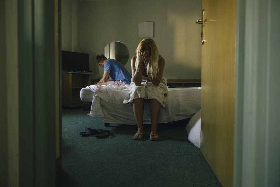 couple arguing in a hotel room