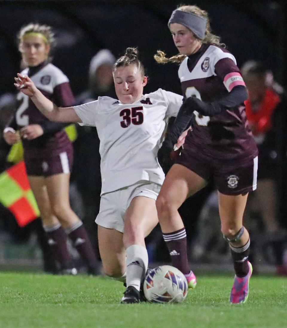 Manchester's Lauren Gunsett battles Stow's Corinne Casenhiser for the ball, Oct. 9, 2023.