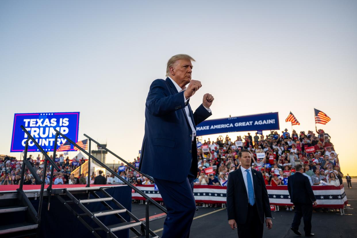 Former US President Donald Trump dances while exiting after speaking during a rally at the Waco Regional Airport on March 25, 2023 in Waco, Texas.
