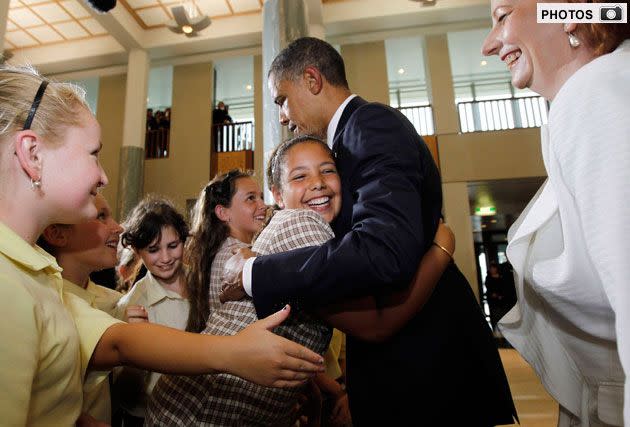 Barack Obama greeting children at Parliament House