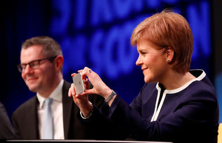 Nicola Sturgeon, First Minister of Scotland, takes a picture at the Scottish National Party (SNP)'s conference in Aberdeen, Scotland, Britain March 17, 2017. REUTERS/Russell Cheyne