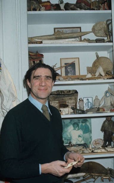 Malaurie in his study in 1976 with Inuit artefacts