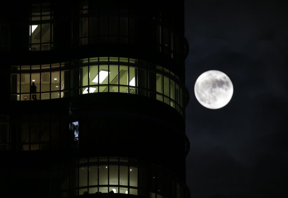 The moon rises next to the Unicredit Tower in Milan, Italy, Monday, Nov. 14, 2016. The brightest moon in almost 69 years lit up the sky, during its closest approach to earth as the "Supermoon" reached its most luminescent phase. The moon won't be this close again until Nov. 25, 2035.