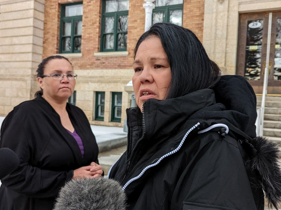 Nerissa Quewezance, left, and her sister Odelia Quewezance outside of the Court of King's Bench in Yorkton in late 2020. A judge decided Monday that both sisters will be released pending a judicial review of their case. (Dayne Patterson/CBC - image credit)