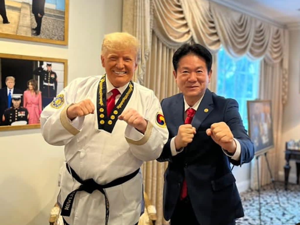A picture of World Taekwondo Headquarters president Lee Dong-sup and former US president Donald Trump (World Taekwondo Headquarters/.Facebook)