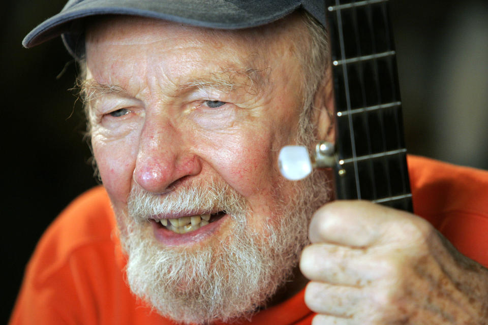 FILE- In this May 5, 2006 file photo, folk singer Pete Seeger is photographed in his home town of Beacon, N.Y. Plans abound to honor Seeger months after the folk legend’s death, with a few early events planned on what would have been his 95th birthday on Saturday, May 3, 2014. (AP Photo/Frank Franklin II, File)