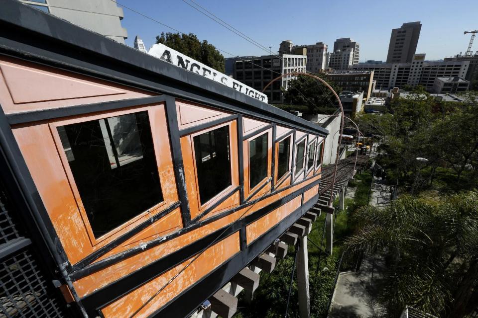 Angels Flight railway is seen in the Bunker Hill section of Los Angeles on Wednesday, March 1, 2017. The tiny funicular that hauled people 298 feet up and down the city's steep Bunker Hill was shut down in 2013 after a series of safety problems. At a news conference Wednesday, March 1, Los Angeles Mayor Eric Garcetti said those issues are being resolved and the railroad's antique wooden cars should be back in service by Labor Day.(AP Photo/Nick Ut)
