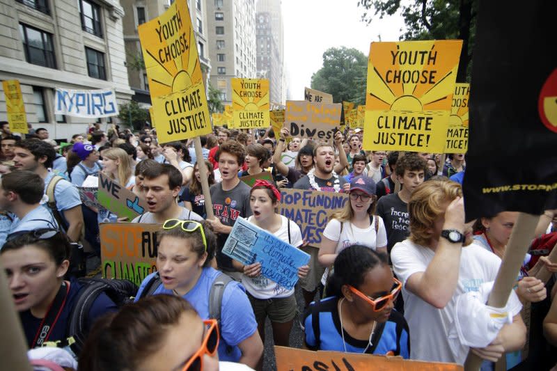 Participants march down Central Park West at the People's Climate March in New York City on September 21, 2014. File Photo by John Angelillo/UPI