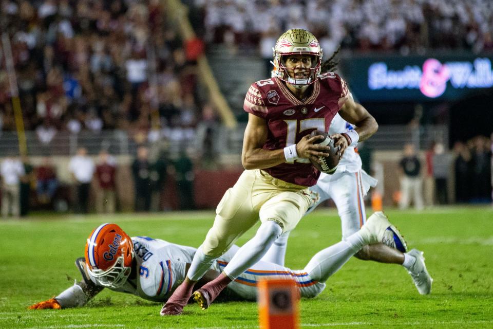 Florida State Seminoles quarterback Jordan Travis (13) eyes the end zone as he runs down the field. The Florida State Seminoles defeated the Florida Gators 45-38 at Doak Campbell Stadium on Friday, Nov. 25, 2022.