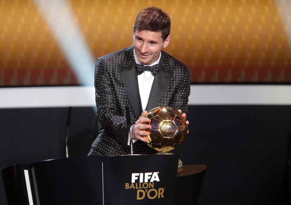 ZURICH, SWITZERLAND - JANUARY 07: Lionel Messi of Argentina receives the FIFA Ballon d'Or 2012 trophy on January 7, 2013 in Zurich, Switzerland. (Photo by Christof Koepsel/Getty Images)