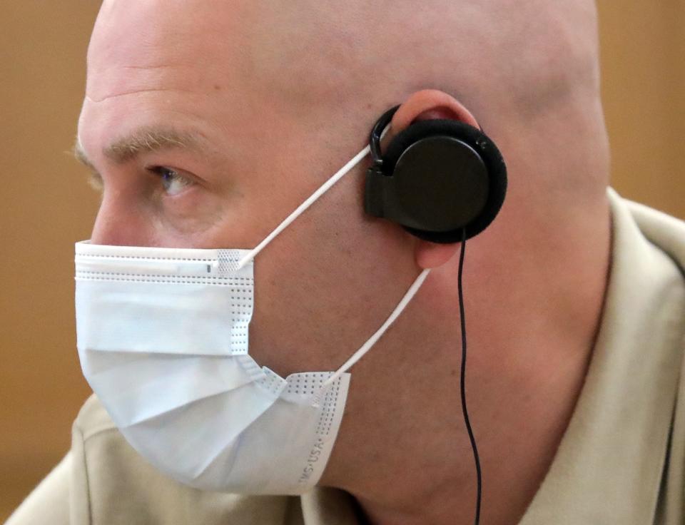 Dr. Anton Ihorovych Halata and other visiting Ukrainian doctors wore headsets to translate conversations with the staff at Akron Children's Hospital during a tour of the hospital's burn center on Wednesday.