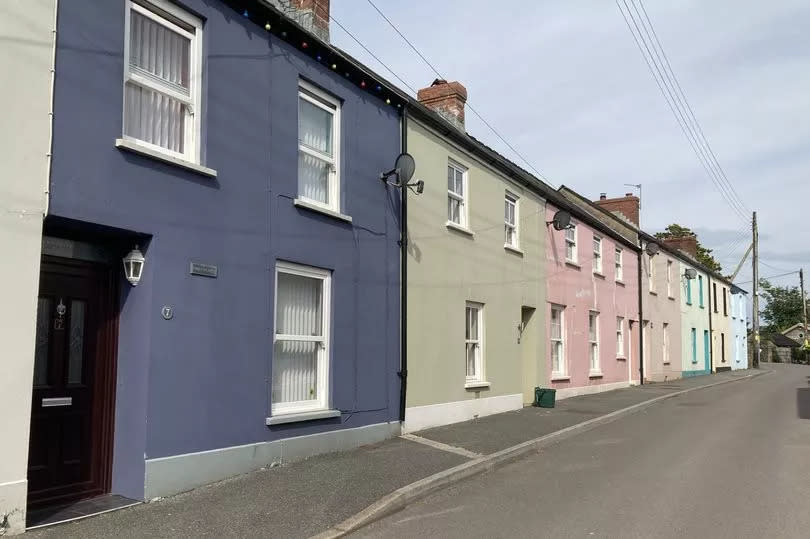 Pretty row of terraced cottages in different colours