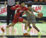 Baylor guard MaCio Teague (31) drives the ball against Texas Tech guard Terrence Shannon Jr. (1) in the second half of an NCAA college basketball game Sunday, March 7, 2021, in Waco, Texas. (AP Photo/Jerry Larson)