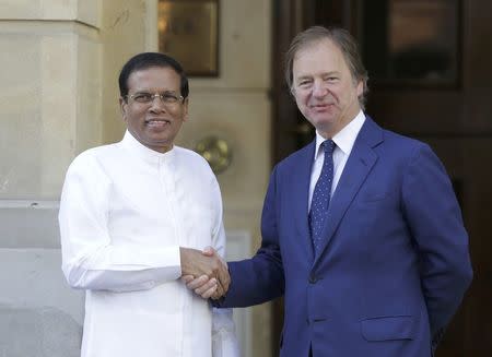 Maithripala Sirisena the President of Sri Lanka (L) is met by Britain's Foreign Office minister Hugo Swire as he arrives at a summit on corruption at Lancaster House in central London, Britain, May 12, 2016. REUTERS/Paul Hackett