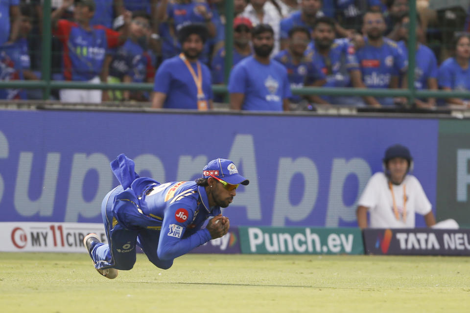 Mumbai Indians' Tilak Varma takes a catch to dismiss Delhi Capitals' Shai Hope during the Indian Premier League cricket match between Delhi Capitals and Mumbai Indians in New Delhi, India, Saturday, April 27, 2024. (AP Photo/ Surjeet Yadav)