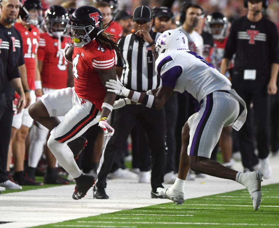 Texas Tech wide receiver Jordan Brown (4) runs with the ball against Tartleton State in a non-conference football game, Saturday, Sept. 16, 2023, at Jones AT&T Stadium.