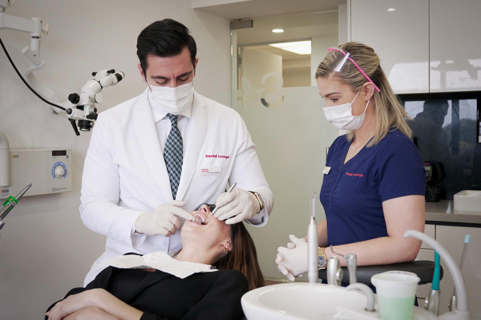 Dr Veridian has a look inside a patient's mouth. Picture: Supplied