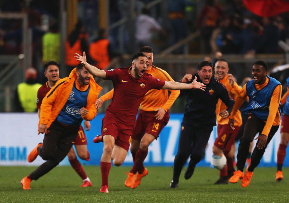 Roma’s Kostas Manolas (center) celebrates after his goal knocked Barcelona out of the Champions League. (Getty)