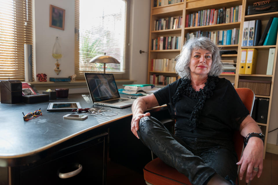 older woman sitting at a home office