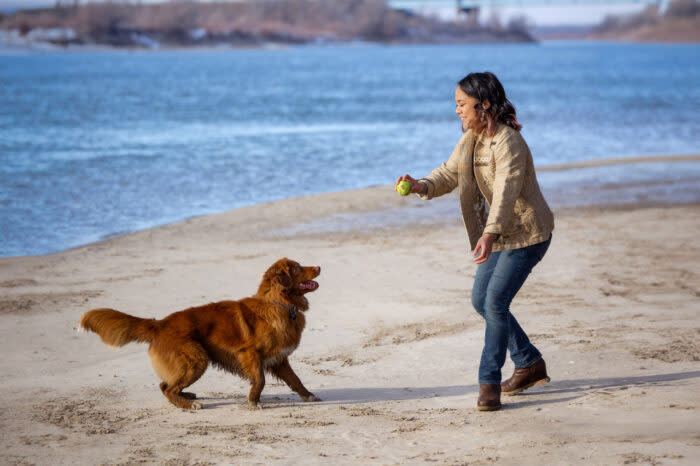 The author enjoying time outside with Rusty, her toller retriever; (photo/Michelle de Leon)