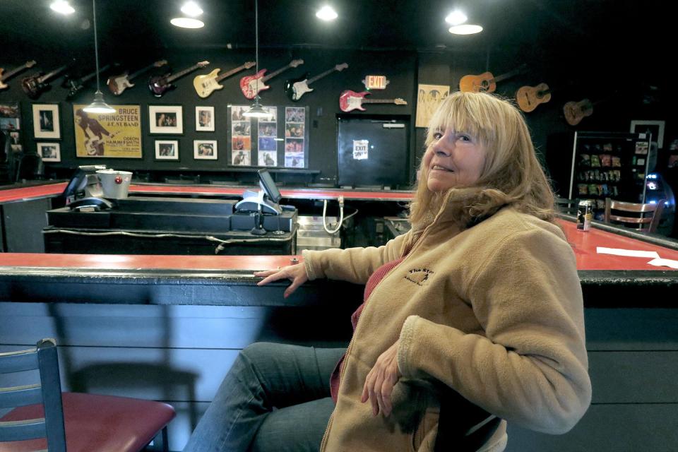Asbury Park Press reporter Jean Mikle sits at the back bar at the Stone Pony in Asbury Park.