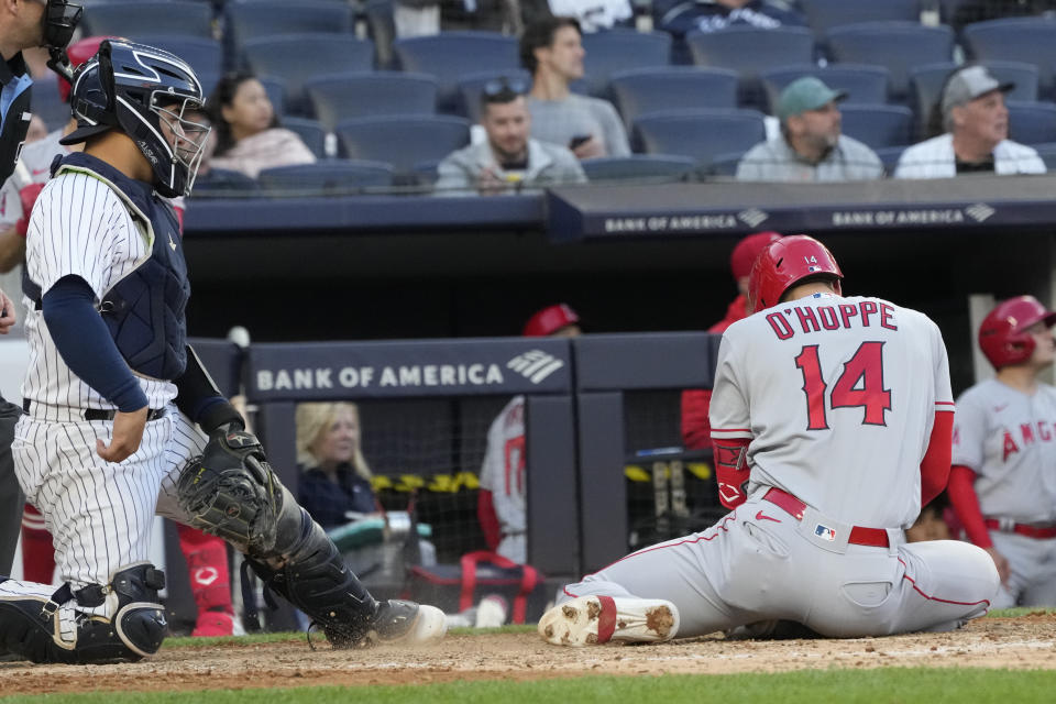Los Angeles Angels' Logan O'Hoppe falls after hitting a single during the ninth inning of the team's baseball game against the New York Yankees, Thursday, April 20, 2023, in New York. The Yankees won 9-3. (AP Photo/Mary Altaffer)