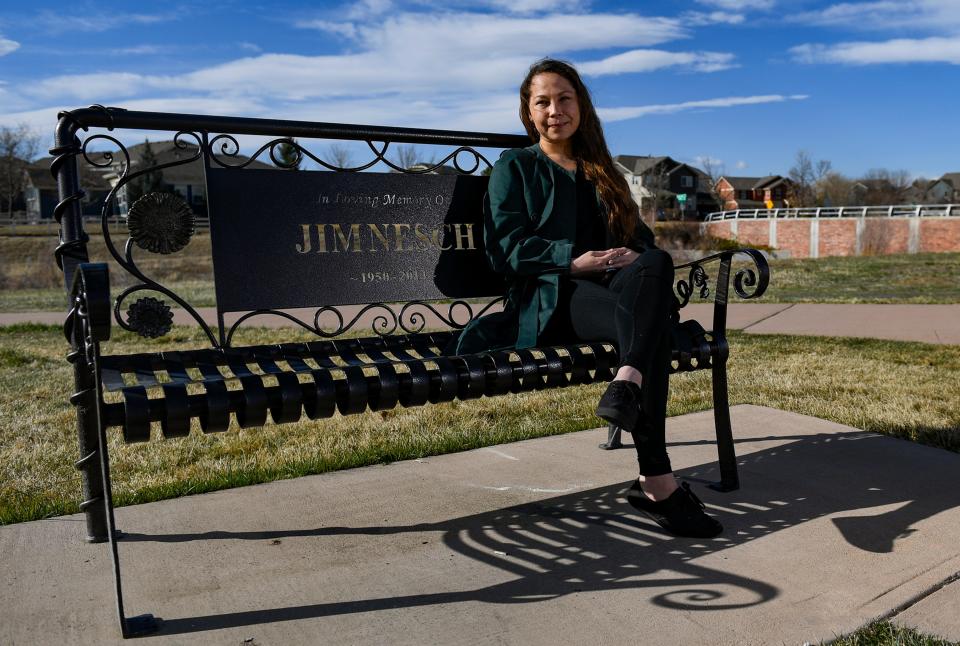 Krystal McMurray sits at a bench that she and her husband, Ryan McMurray, installed at Rigden Farm Community Garden in Fort Collins, Colorado, on Saturday, March 26, 2022.