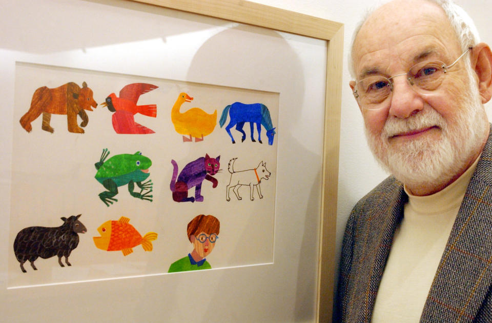 Eric Carle, an illustrator and author of children&rsquo;s books, with a print of some of his illustrations. Carle died on May 23 at age 91. (Photo: Matthew J. Lee for The Boston Globe via Getty Images)