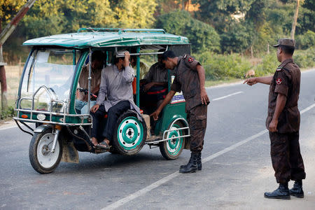 Security personnel check an auto-rickshaw near a check post to identify Rohingya refugee in Cox’s Bazar, Bangladesh, November 21, 2016. REUTERS/Mohammad Ponir Hossain