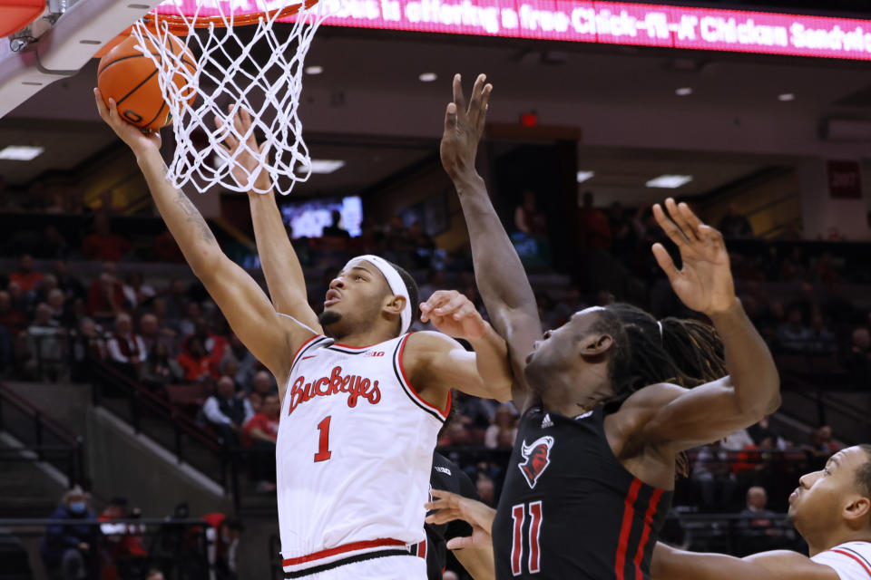 Ohio State's Roddy Gayle, left, shoots next to Rutgers' Clifford Omoruyi during the second half of an NCAA college basketball game Thursday, Dec. 8, 2022, in Columbus, Ohio. (AP Photo/Jay LaPrete)