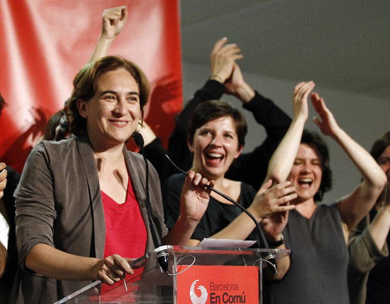 Barcelona en Comu leader and mayoral candidate for Barcelona, Ada Colau (L), celebrates her party's victory in Spain's municipal and regional elections, on May 24, 2015 in Barcelona