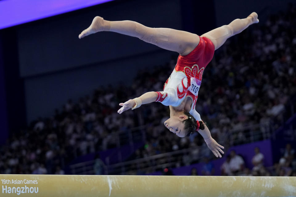 China's Xijing Tang competes in the Artistic Gymnastics women's balance beam final at 19th Asian Games in Hangzhou, China, Friday, Sept. 29, 2023. Tang won the silver medal. (AP Photo/Aijaz Rahi)