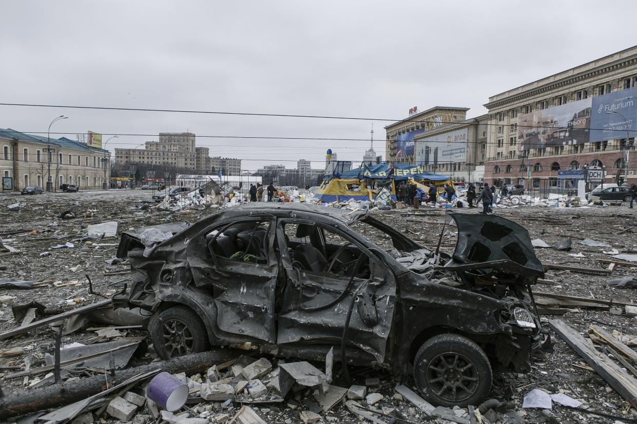 A wrecked car sits in central Kharkiv, Ukraine, on Tuesday.