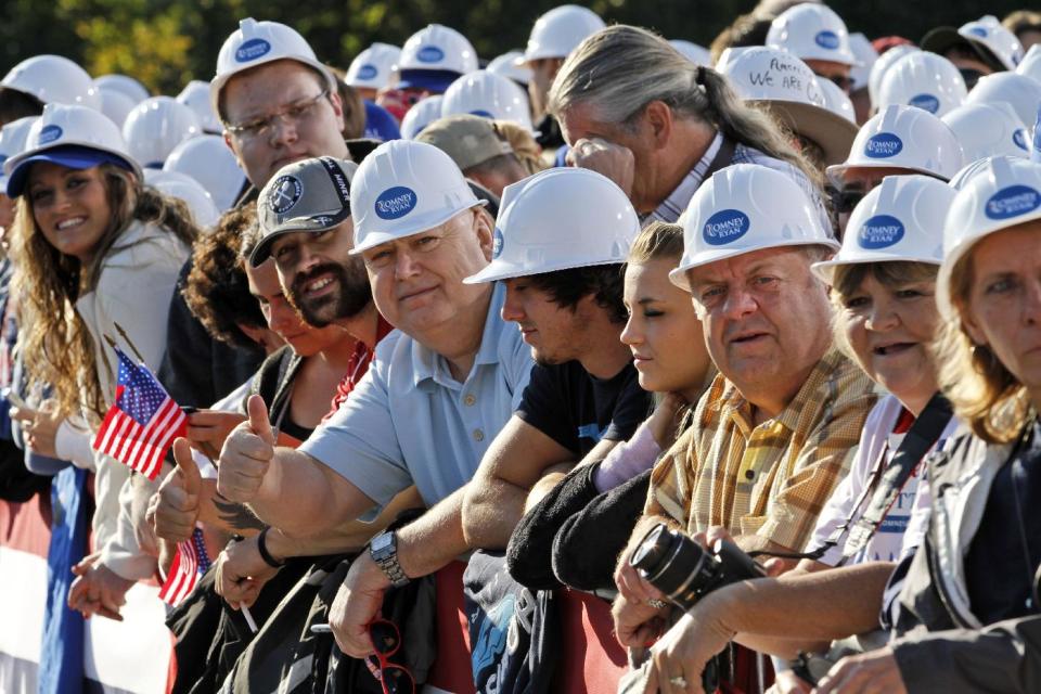 Supporters for Republican presidential candidate, former Massachusetts Gov. Mitt Romney, don coal miners hats as they wait for a rally in Abington, Va., Friday, Oct. 5, 2012. (AP Photo/Steve Helber)