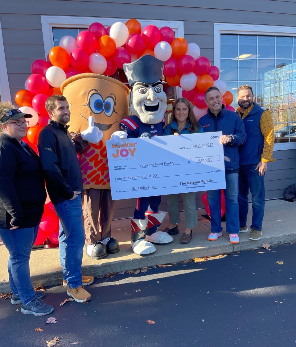 Dunkin’ Franchisee Durval Salema and his brothers presented a check for $4,000 to Footprints Food Pantry of Kittery. From left to right are Eliot Dunkin’ Manager Jodi Allen, Dunkin’ Franchisee Isaac Salema, Dunkin’ mascot Icy Joe, New England Patriots mascot Pat Patriot, Footprints Food Pantry Executive Director Megan Shapiro Ross, Dunkin’ Franchisee Durval Salema, and Dunkin' Franchisee Shawn Salema.