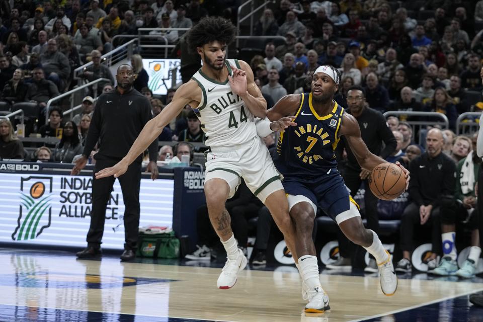 Indiana Pacers' Buddy Hield (7) goes to the basket against Milwaukee Bucks' Andre Jackson Jr. (44) during the first half of an NBA basketball game, Wednesday, Jan. 3, 2024, in Indianapolis. (AP Photo/Darron Cummings)