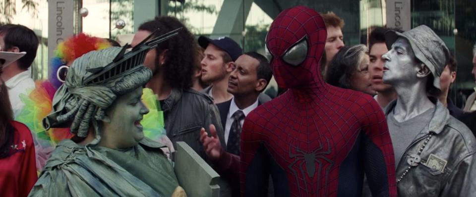 Aidy Bryant dressed as Lady Liberty and talking to Andrew Garfield as Spider-Man in "The Amazing Spider-Man 2."