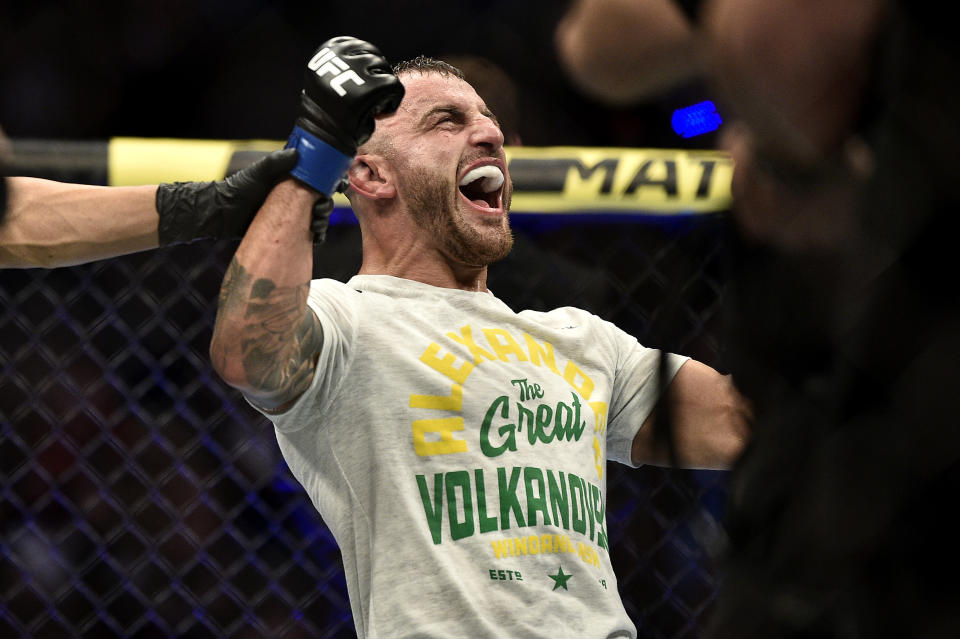 LAS VEGAS, NEVADA - DECEMBER 14:  Alexander Volkanovski of Australia celebrates his win in the octagon during the UFC 245 event at T-Mobile Arena on December 14, 2019 in Las Vegas, Nevada. (Photo by Chris Unger/Zuffa LLC)