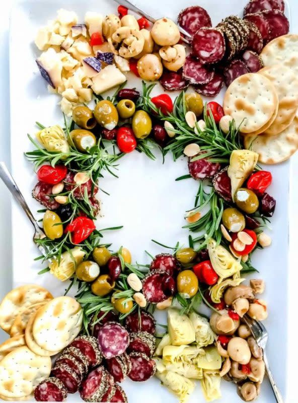 <p>Courtesy of foodiecrush.com</p><p>Foodiecrush says "Antipasto can include meats and cheese, but the real heroes are briny olives, marinated artichokes, mushrooms, peppers and nuts."</p><p><strong>Get the Recipe: <a href="https://www.foodiecrush.com/antipasto-christmas-wreath-appetizer/" rel="nofollow noopener" target="_blank" data-ylk="slk:Antipasto Christmas Wreath;elm:context_link;itc:0;sec:content-canvas" class="link ">Antipasto Christmas Wreath</a></strong></p>